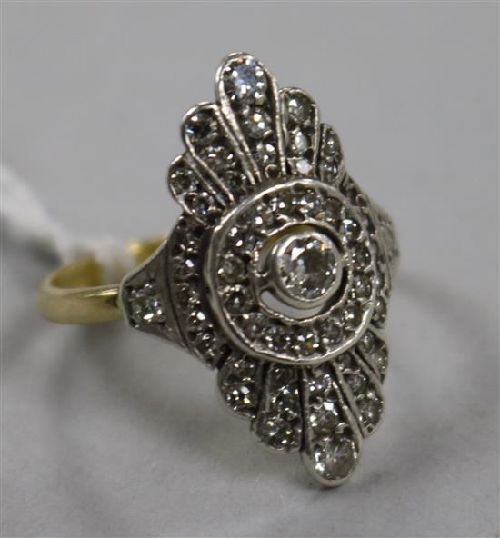 An Art Deco 15ct gold and diamond set dress ring, size L.